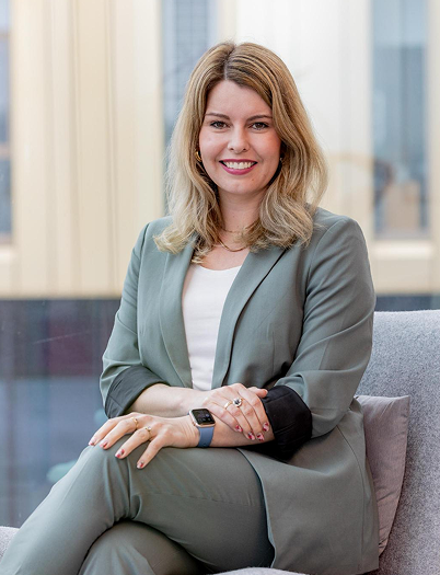 Woman in suit sat down