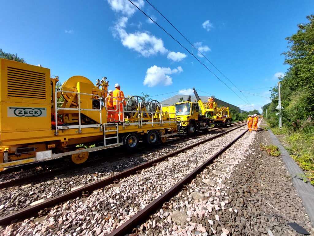 Vehicles on a Metro track replacing overhead lines