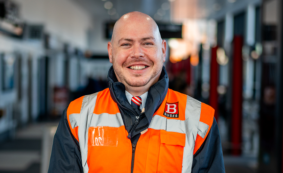A Nexus employee in bus station uniform