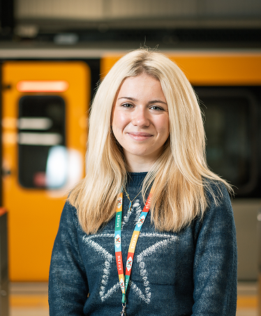 Blonde woman smiling at the camera
