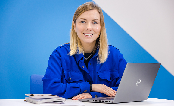 A female sat a laptop