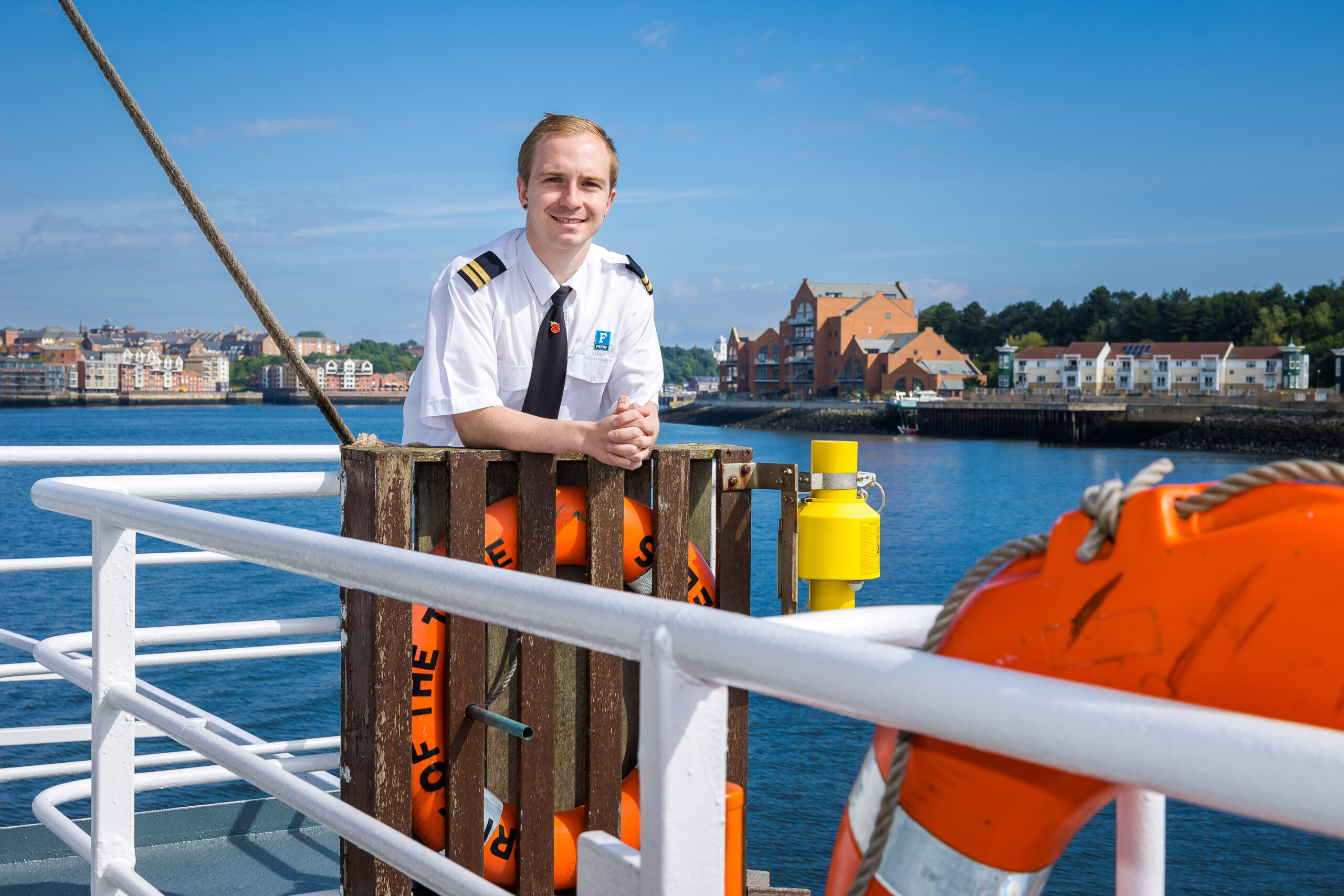 Man standing on board a ferry