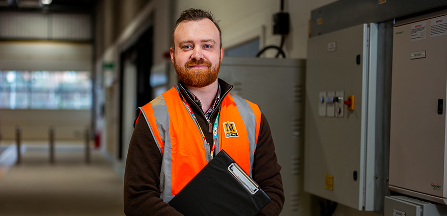 A male nexus employee wearing a high vis vest