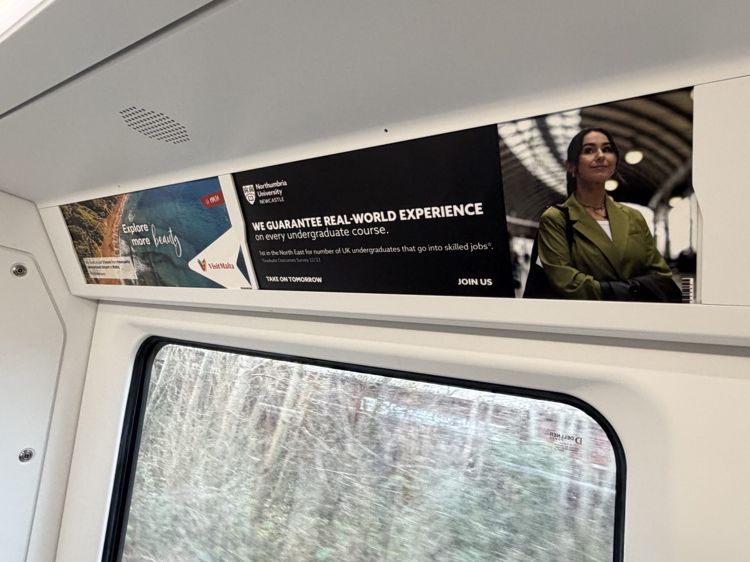 Images of advertising cards on a Metro train